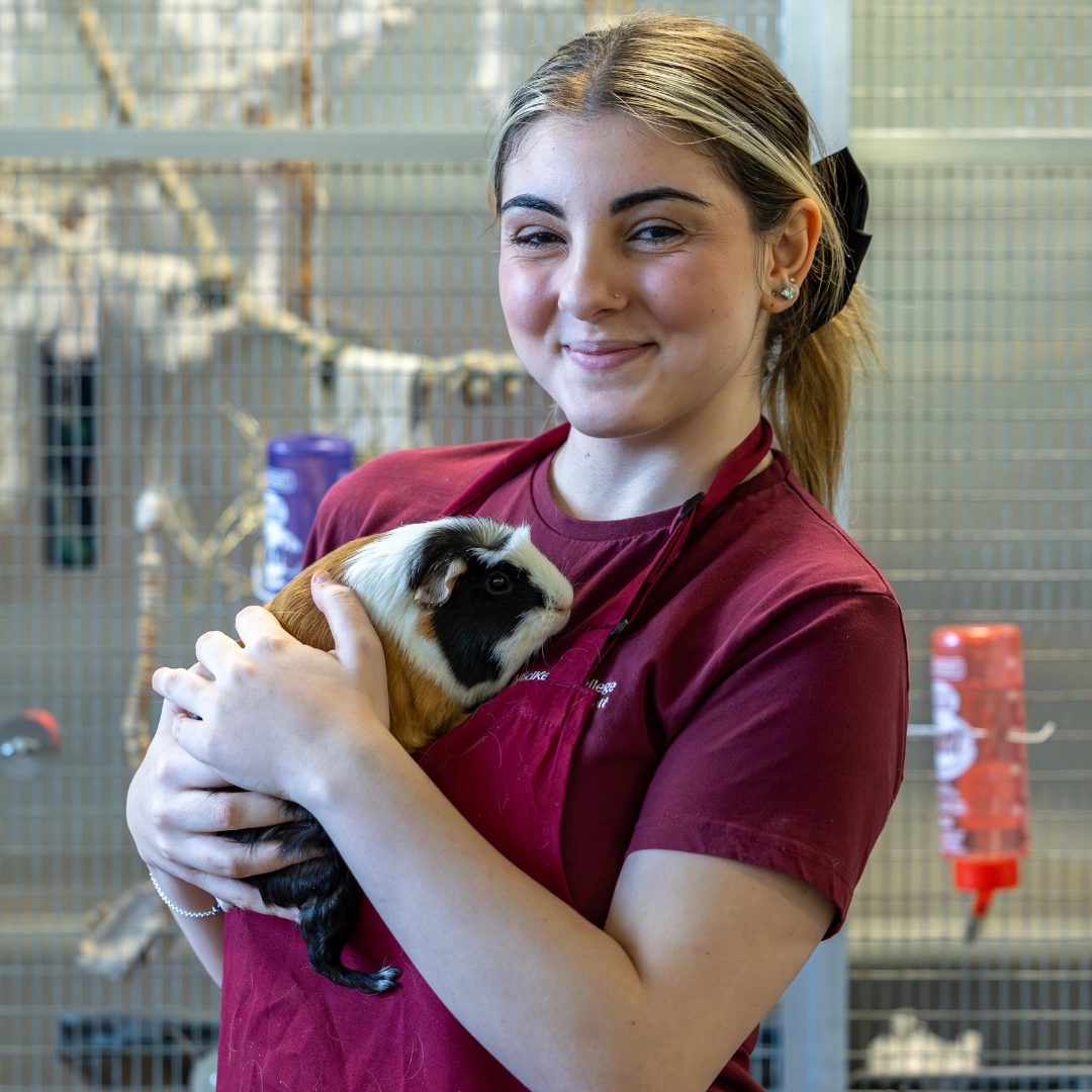 Animal Management student holding a spider