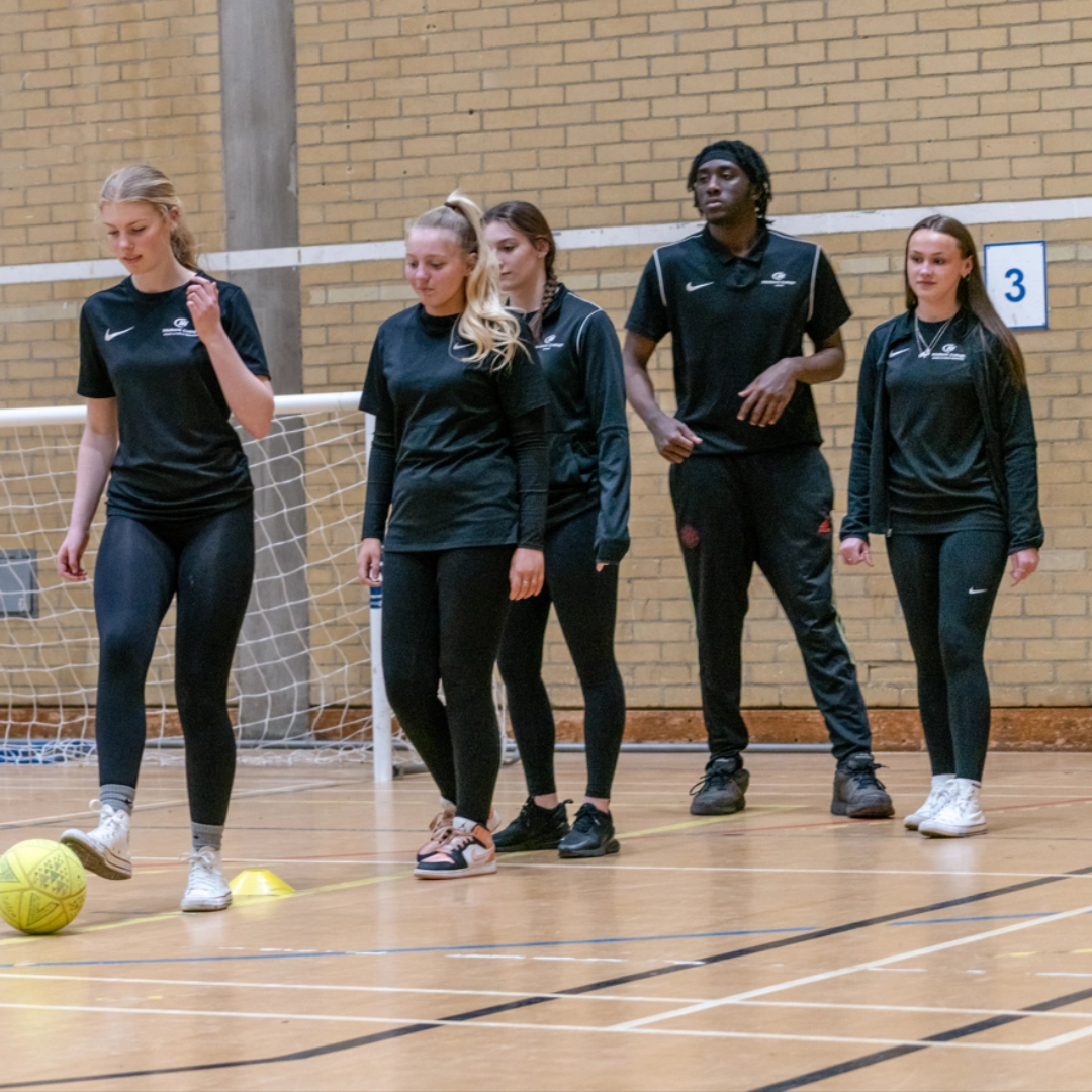 Sport student swinging a bat