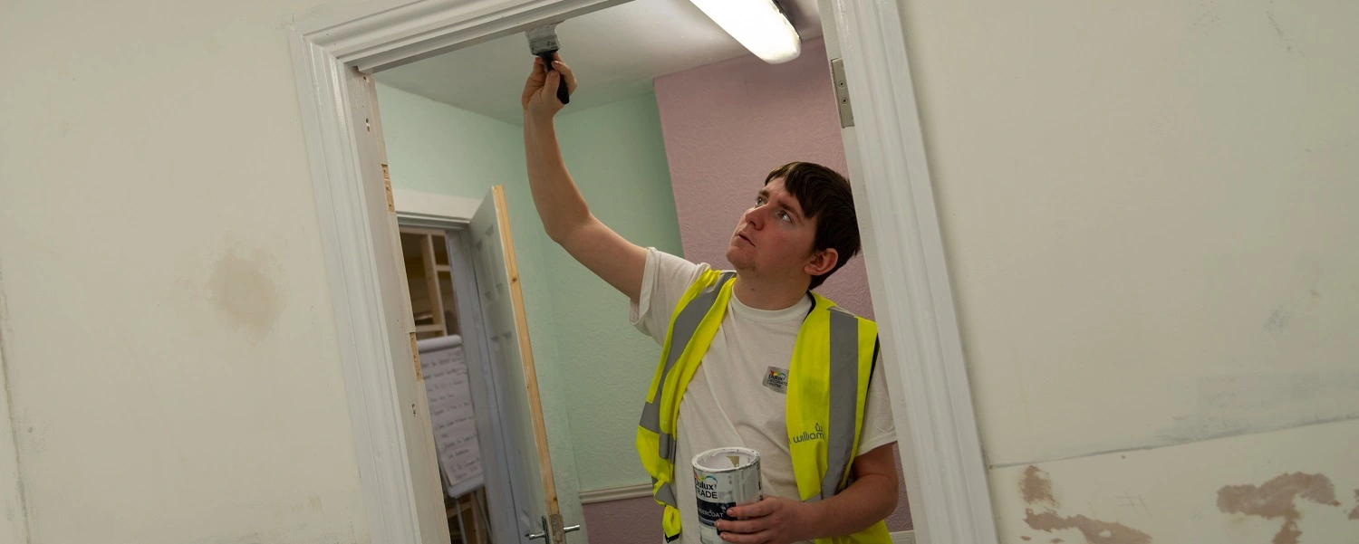 Painting & Decorating student glossing a doorway