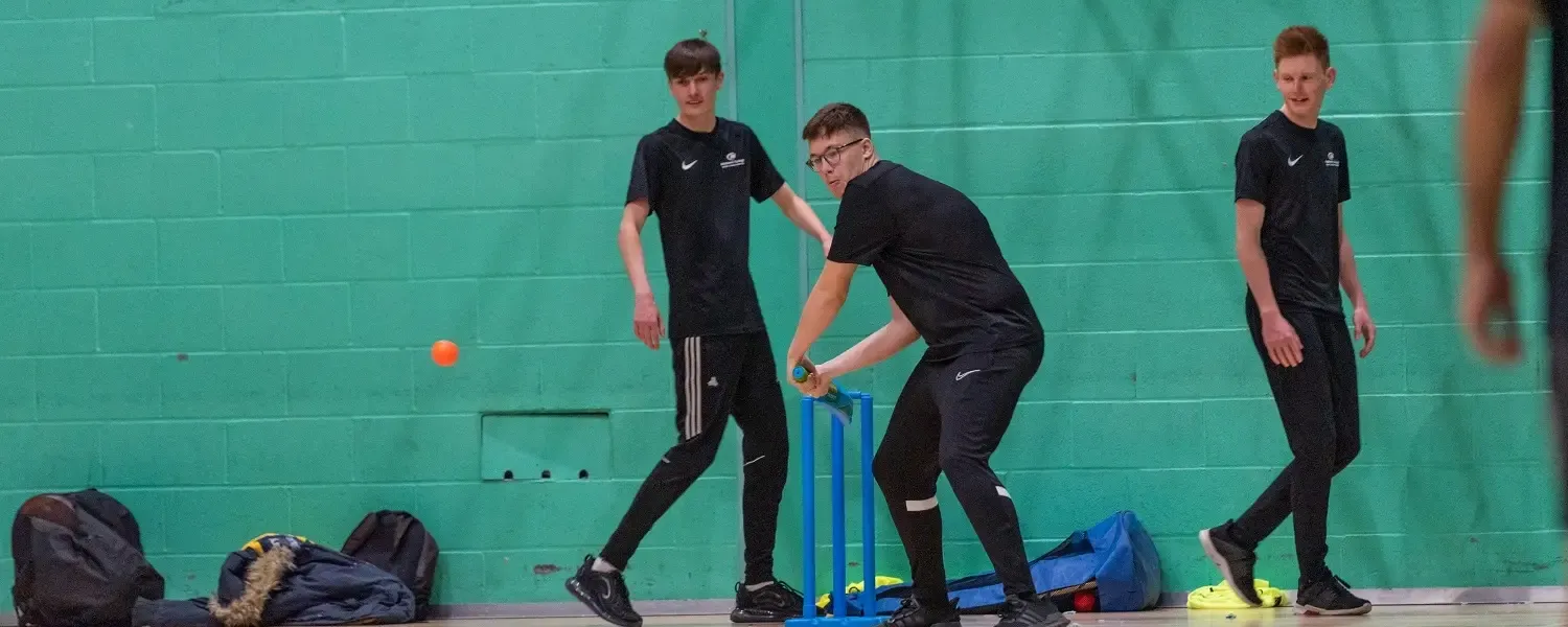 Sport students playing indoor cricket