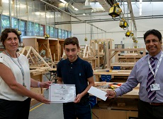 Carpentry Student receiving a certificate
