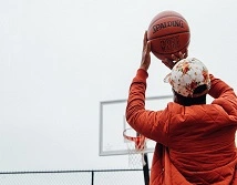 Student playing basketball