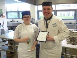 Catering student receiving an award