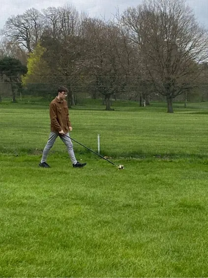 student playing golf