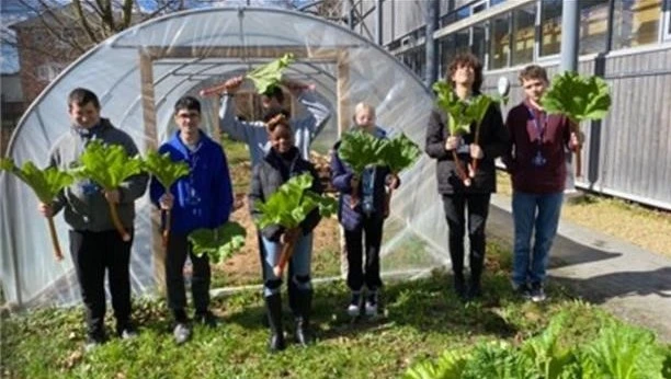 Students with home-grown rhubarb