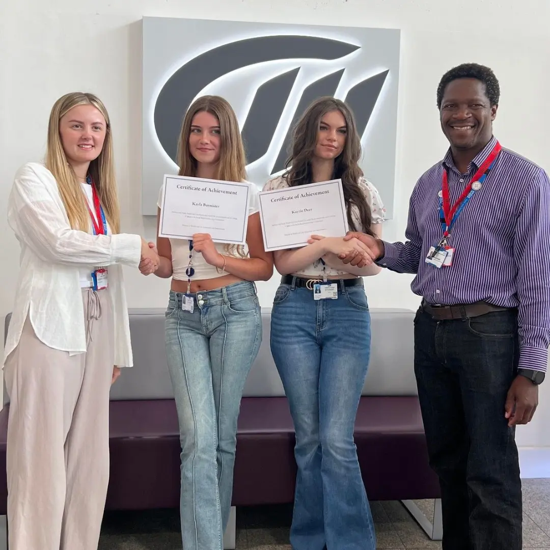 MidKent College students receiving certificates from Medway and Swale Partnership for a logo comeptition