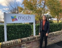 Jazmine in front of the MCCH sign