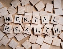 Mental health letters on wooden tiles
