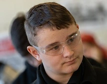 A student with safety glasses on